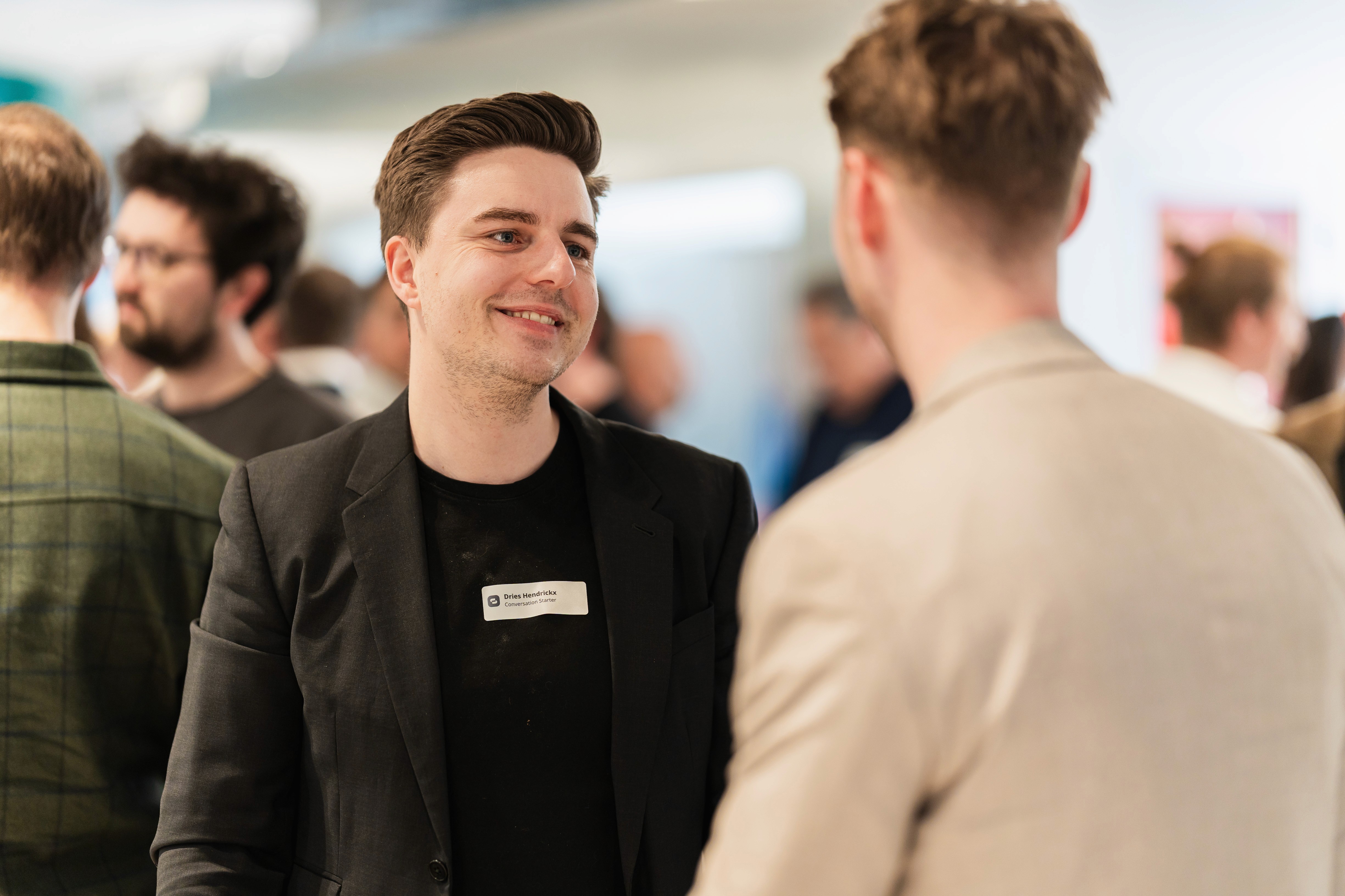 Sales professionals talking at an event