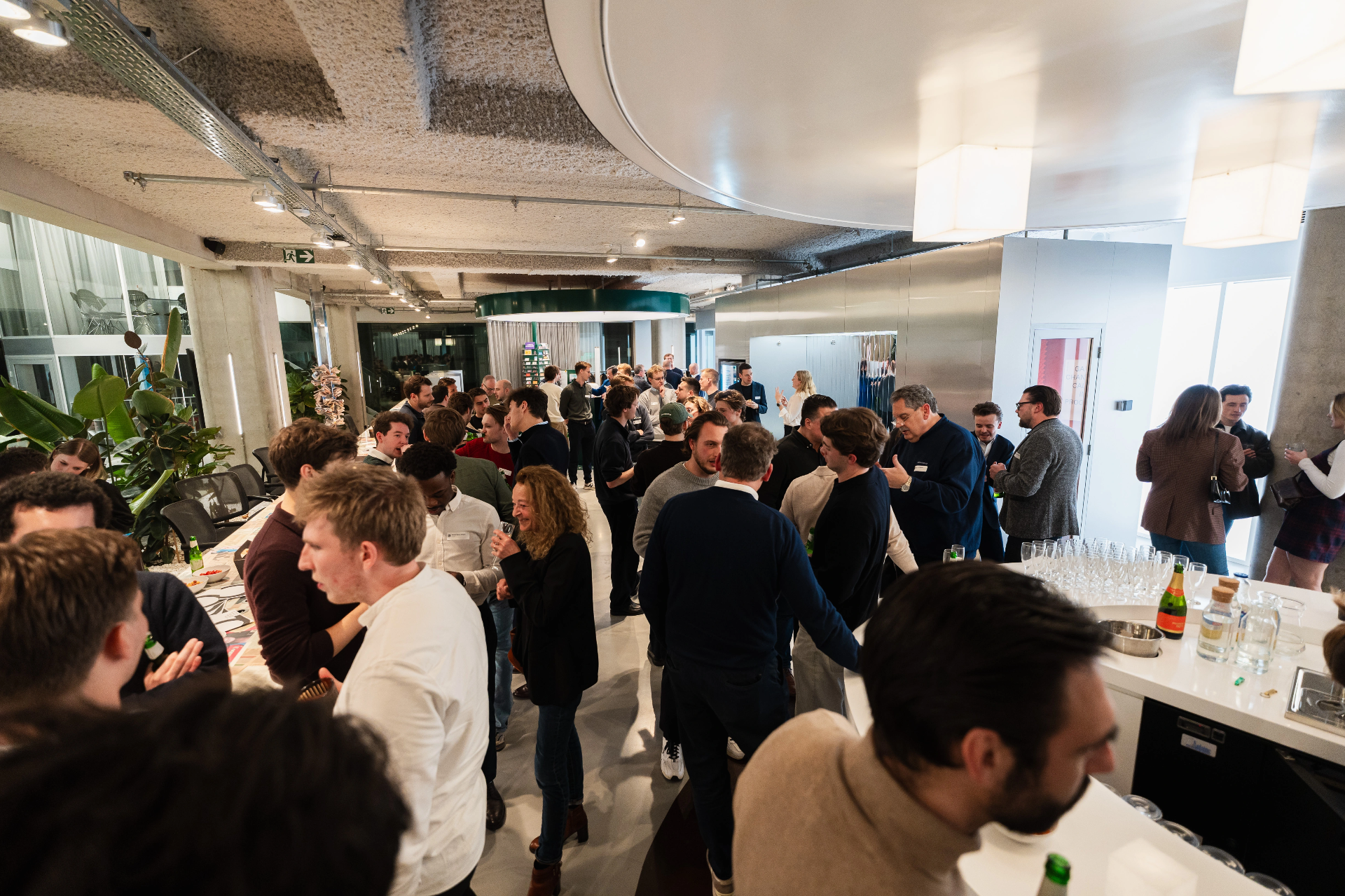 Two attendees in conversation at a business event whose contact details sync to Pipedrive